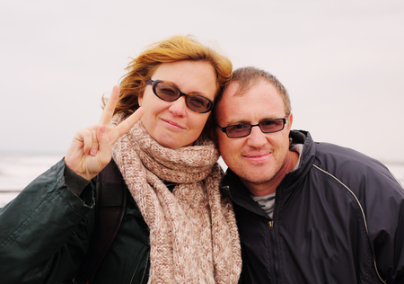 Portrait of happy midage couple on vacationの写真素材
