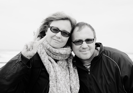Portrait of happy midage couple on vacationの写真素材