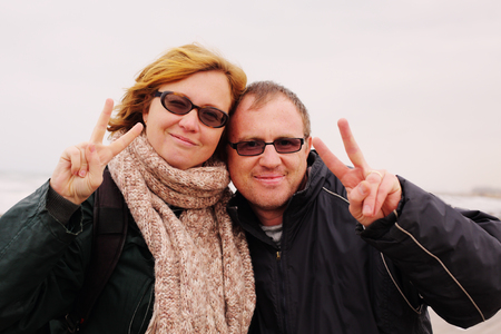 Portrait of happy midage couple on vacationの写真素材