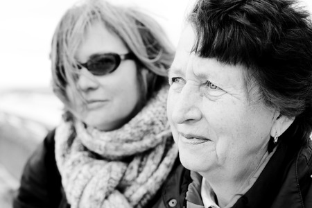 Portrait of beautiful senior woman and her adult daughterの写真素材