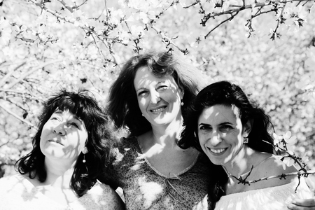 Portrait of three best friends standing in the gardenの写真素材