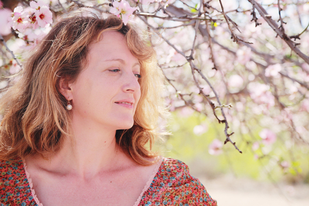 Spring portrait of beautiful 40 years old woman outdoorsの写真素材