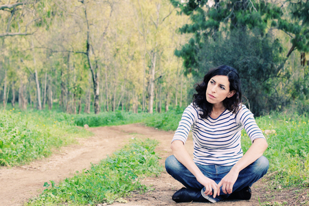 Portrait of beautiful 40 years old woman outdoorsの写真素材