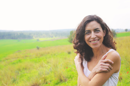 Portrait of beautiful 40 years old woman outdoorsの写真素材