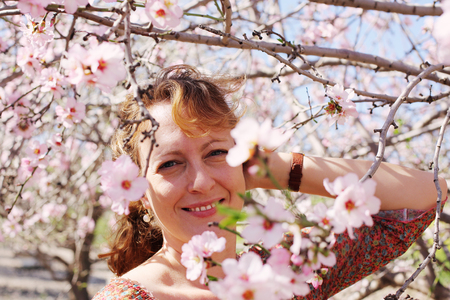 Spring portrait of beautiful 40 years old woman outdoorsの写真素材