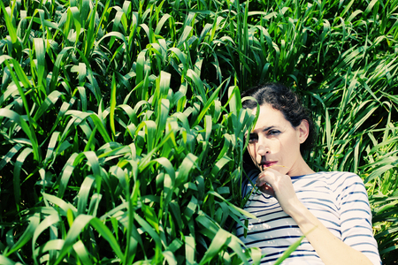 outdoor portrait of a beautiful middle aged womanの写真素材