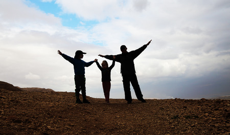 silhouette of father with two kidsの写真素材