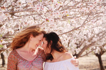 best friends walking in the gardenの写真素材
