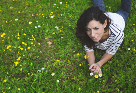 outdoor portrait of a beautiful middle aged womanの写真素材