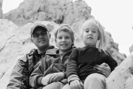 Portrait of happy father with two kidsの写真素材