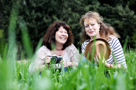 best friends walking in the parkの写真素材