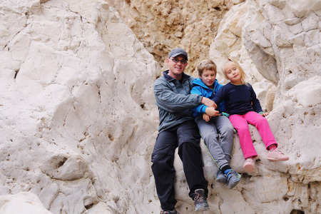 Portrait of happy father with two kidsの写真素材
