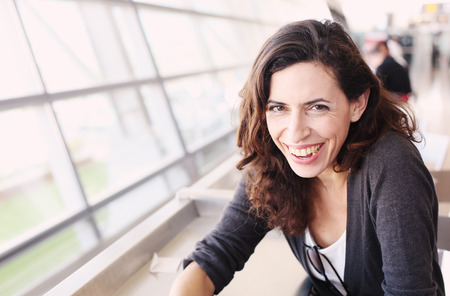 Portrait of beautiful 40 years old woman holding cup of coffeeの写真素材