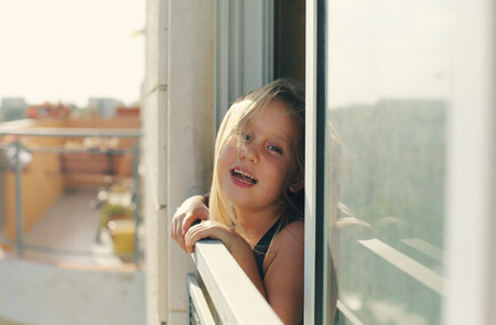 Portrait of 5 years old girl looking to the streetの写真素材