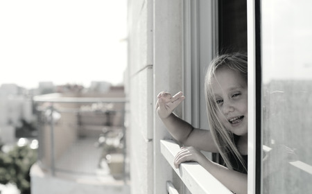 Portrait of 5 years old girl looking to the streetの写真素材