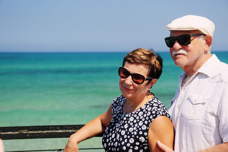 senior couple walking near the seaの写真素材