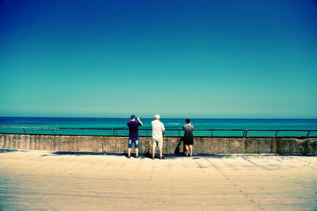 Senior parents with adult son traveling togetherの写真素材