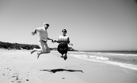 senior couple walking on the beachの写真素材