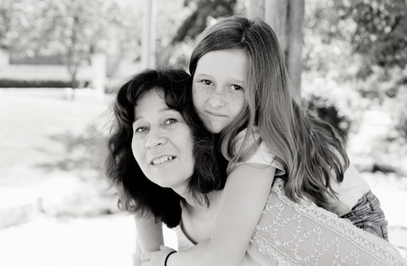 Outdoor portrait of mother and daughterの写真素材
