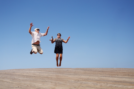 senior couple jumpingの写真素材