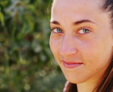 Close up portrait of 25 years old woman outdoors