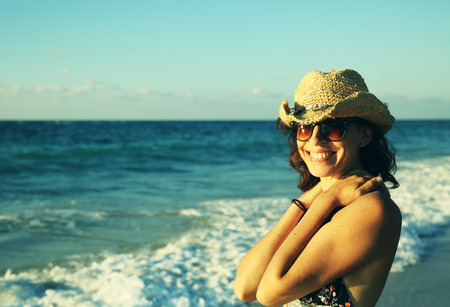 Beautifull 40 years old woman walking on the beach. Sunset colorsの写真素材