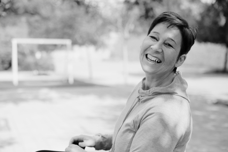 Portrait of beautiful 40 years old woman outdoorsの写真素材