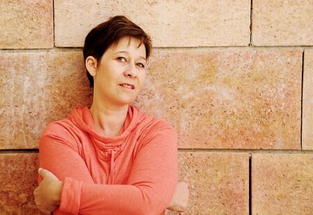 Portrait of beautiful 45 years old woman outdoorsの写真素材