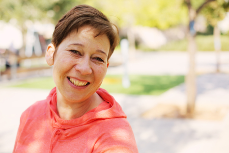 Portrait of beautiful 45 years old woman outdoors