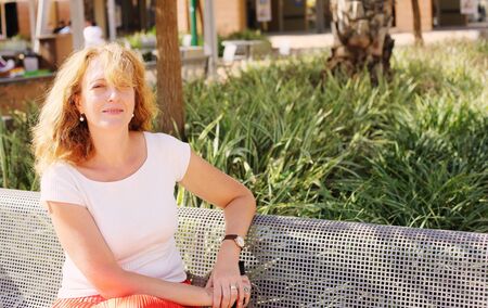 Portrait of beautiful 45 years old woman outdoorsの写真素材