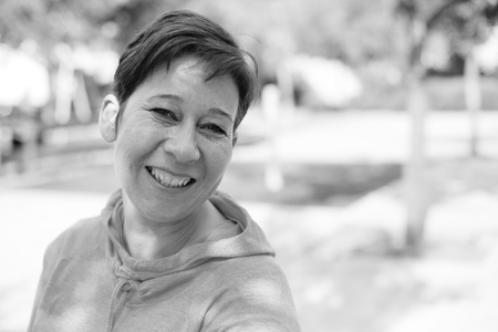 Portrait of beautiful 45 years old woman outdoorsの写真素材