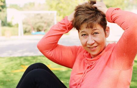 Portrait of beautiful 45 years old woman outdoorsの写真素材