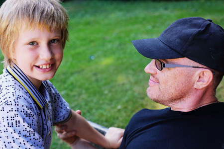 Portrait of father and son outdoorsの写真素材