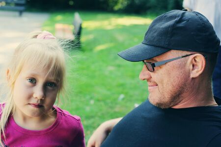 Portrait of father and daughter outdoorsの写真素材