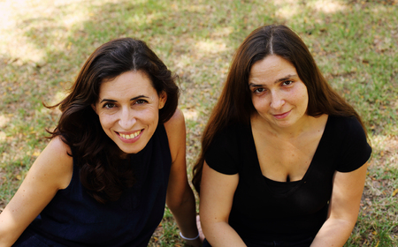 Portrait of two smiling 40 years old women outdoorsの写真素材