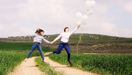 Happy mother and daughter jumping together. Mother day.の写真素材