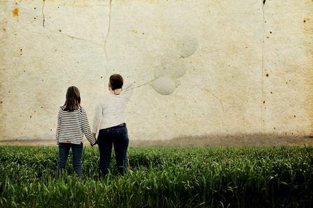 Happy mother and daughter jumping together. Mother day.の写真素材