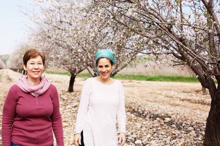 Outdoor portrait of two 45 years old womanの写真素材