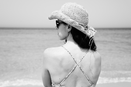 Portrait of  real beautiful 40 years old woman standing on seasideの写真素材