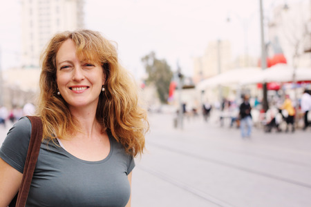 Portrait of smiling 40 years old woman outdoorsの写真素材