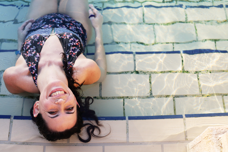 Portrait  of 40 years old women in swimming-poolの写真素材