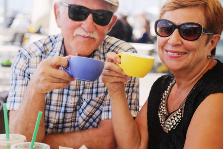 Portrait of senior woman sitting in summer cafeの写真素材