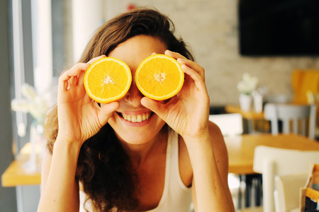 Portrait of beautiful 40 years old woman sitting in the cafeの写真素材