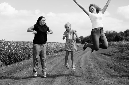 Portrait of beautiful mothers with kids outdoorsの写真素材