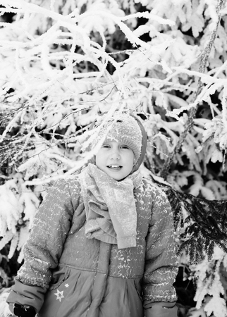 Winter portrait of a adorable 7 years old girl outdoorsの写真素材