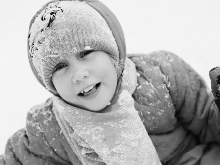 Winter portrait of a adorable 7 years old girl outdoorsの写真素材