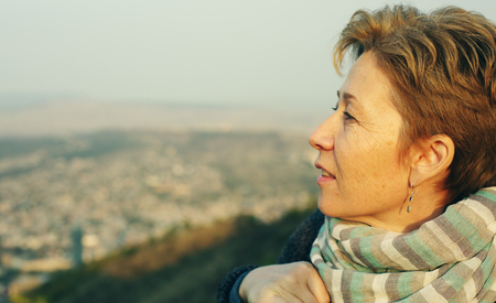 Portrait of beautiful 45 years old woman outdoorsの写真素材