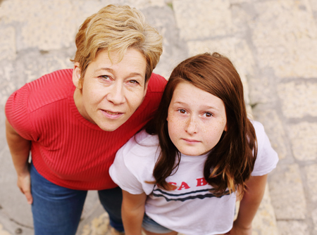 Mature mother traveling with her teen daughterの写真素材