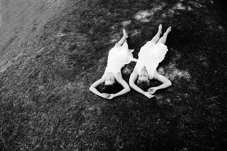Mother and her daughter having fun in the park. Positive human emotions, feelings, joy.の写真素材