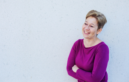 Portrait of smiling 45 years old woman outdoorsの写真素材